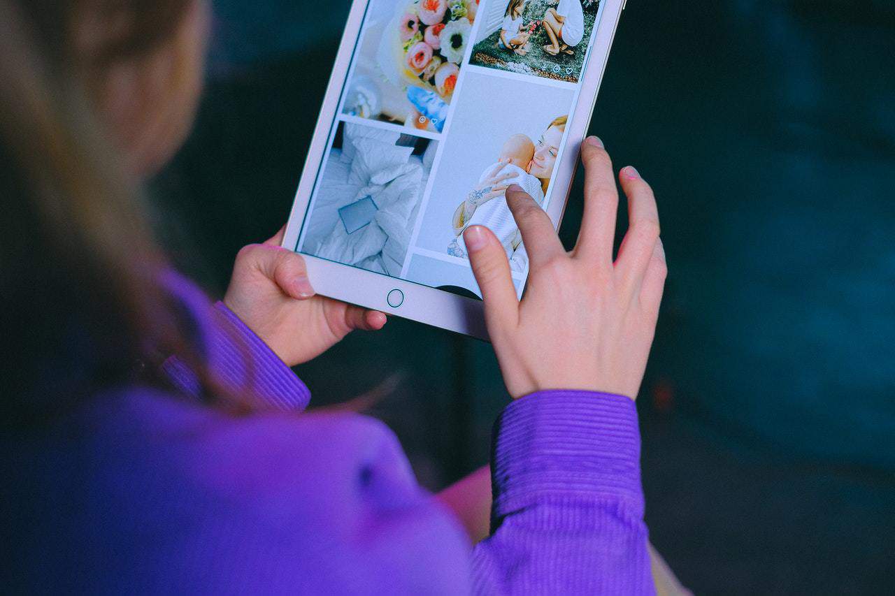 Woman looking at images on ipad